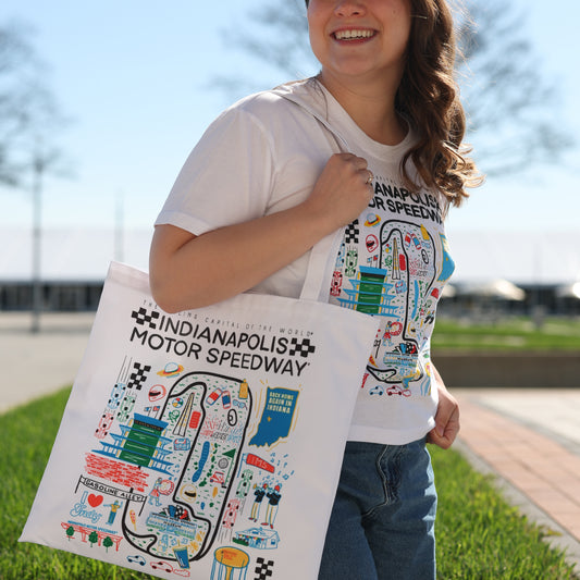 Indianapolis Motor Speedway Scenic Design Canvas Tote In White & Multi-Color - Bag Front View On Model